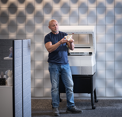 A man holding 3D printed model