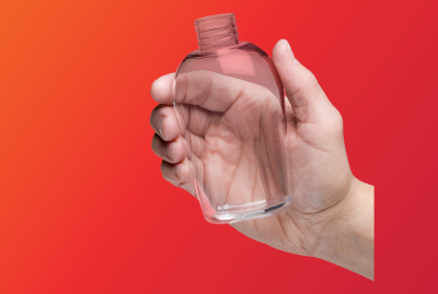A hand holding 3Dprinted transparent bottle prototype