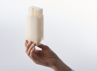 A hand holding 3D printed model A hand holding 3D printed model